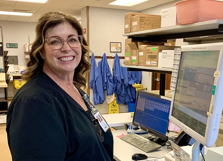 Lab professional working in the Guttenberg Municipal Hospital & Clinics laboratory.