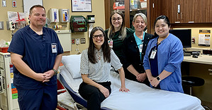 Healthcare team at Guttenberg Hospital with Amy in the hospital bed.
